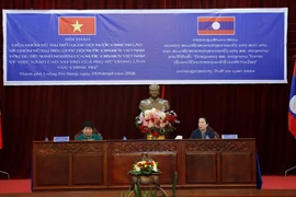 Bà Nguyễn Thúy Anh và bà Thummaly Vongphachanh chủ trì Hội thảo. (Ảnh: Phạm Kiên/TTXVN)