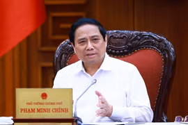 Thủ tướng Phạm Minh Chính chủ trì cuộc họp tháo gỡ khó khăn, thúc đẩy phát triển nhà ở xã hội. (Ảnh: Dương Giang/TTXVN)