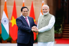 Thủ tướng Phạm Minh Chính​ và Thủ tướng Ấn Độ Narendra Modi. (Ảnh: Dương Giang/TTXVN)