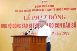 Đồng chí Đỗ Văn Chiến, Ủy viên Bộ Chính trị, Bí thư Trung ương Đảng, Chủ tịch Ủy ban Trung ương MTTQ Việt Nam đọc lời kêu gọi tại Lễ phát động. (Ảnh: Phương Hoa/TTXVN)