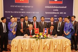 Quang cảnh lễ ký Biên bản hợp tác giữa hai cơ quan thanh tra. (Ảnh: Phạm Kiên/Vietnam+)