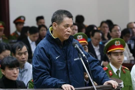 Nguyên Tổng giám đốc Agribank Phạm Thanh Tân đứng trước vành móng ngựa. (Ảnh: Doãn Tấn/TTXVN)