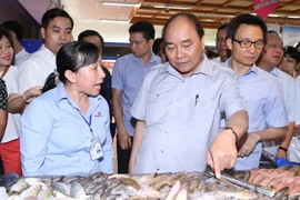 Thủ tướng Nguyễn Xuân Phúc kiểm tra tại quán phở trên đường Nguyễn Hậu, phường Tân Thành, quận Tân Phú, Thành phố Hồ Chí Minh. (Ảnh: Thống Nhất/TTXVN)