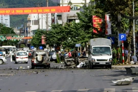 Hiện trường vụ cháy nổ xe taxi. (Ảnh: Lê Trung Nguyên/TTXVN) 