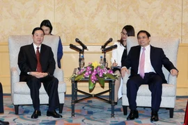 Ông Phạm Minh Chính, Ủy viên Bộ Chính trị, Bí thư Trung ương Đảng, Trưởng ban Tổ chức Trung ương tiếp ông Lưu Kỳ Bảo, Ủy viên Bộ Chính trị, Bí thư Ban Bí thư, Trưởng ban Tuyên truyền Trung ương đang thăm và làm việc tại Việt Nam. (Ảnh: Phạm Kiên/TTXVN) 