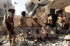 Lực lượng trung thành với Chính phủ Lybia trong chiến dịch truy quét phiến quân IS tại thành phố Sirte ngày 14/10. (Nguồn: AFP/TTXVN)