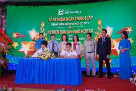 Hai bên ký kết hợp tác. (Ảnh: PV/Vietnam+)