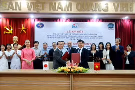 Hình ảnh buổi lễ ký kết hợp tác. (Ảnh: PV/Vietnam+)