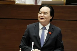 Đại biểu Quốc hội tỉnh Thái Bình Nguyễn Thu Dung chất vấn Bộ trưởng Bộ Giáo dục và Đào tạo Phùng Xuân Nhạ. (Ảnh: Văn Điệp/TTXVN)