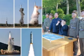 Nhà lãnh đạo Triều Tiên Kim Jong-un (giữa, ảnh phải) thị sát vụ phóng thử tên lửa đạn đạo tầm trung Pukguksong-2 tại tỉnh Pukchang, miền Tây Triều Tiên ngày 22/5/2017. (Ảnh: Yonhap/TTXVN)