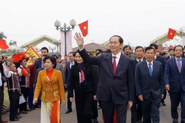 Chủ tịch nước Trần Đại Quang dự Ngày hội "Sắc xuân trên mọi miền Tổ quốc," sáng 24/2/2018, tại Làng Văn hóa-Du lịch các Dân tộc Việt Nam ở Đồng Mô, Sơn Tây, Hà Nội. (Ảnh: Doãn Tấn/TTXVN)