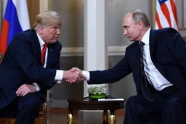 Tổng thống Nga Vladimir Putin (phải) và Tổng thống Mỹ Donald Trump tại hội nghị thượng đỉnh ở Helsinki, Phần Lan ngày 16/7 vừa qua. (Ảnh: AFP/TTXVN)
