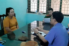 Đối tượng Nguyễn Thị Liên tại cơ quan điều tra. (Ảnh:TTXVN phát)
