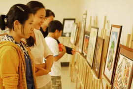 Triển lãm tranh Biếm họa báo chí Việt Nam-Cúp Rồng tre lần thứ III. (Ảnh: Mạnh Linh/TTXVN)