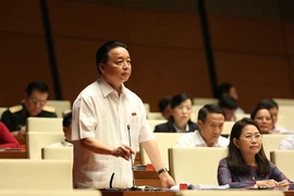 Bộ trưởng Bộ Tài nguyên và Môi trường Trần Hồng Hà phát biểu giải trình một số ý kiến đại biểu Quốc hội nêu. (Ảnh: Dương Giang/TTXVN)