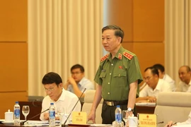 Bộ trưởng Bộ Công an Tô Lâm trả lời chất vấn của các đại biểu Quốc hội. (Ảnh: Dương Giang/TTXVN)