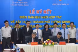 Quang cảnh lễ ký kết. (Ảnh: Đinh Văn Nhiều/TTXVN)