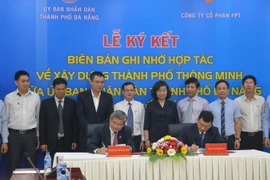 Quang cảnh lễ ký kết. (Ảnh: Đinh Văn Nhiều/TTXVN)