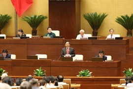 Bộ trưởng Bộ Giao thông Vận tải Nguyễn Văn Thể trả lời chất vấn. (Ảnh: Phương Hoa/TTXVN)