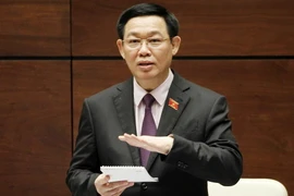 Phó Thủ tướng Vương Đình Huệ trả lời chất vấn của Đại biểu Quốc hội. (Ảnh: Văn Điệp/TTXVN)