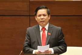Bộ trưởng Bộ Giao thông Vận tải Nguyễn Văn Thể trả lời chất vấn. (Ảnh: Phương Hoa/TTXVN)