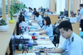 Khu vực tiếp nhận, giải quyết hồ sơ của doanh nghiệp tại Chi cục Hải quan cửa khẩu cảng Đình Vũ. (Ảnh: Minh Thu/TTXVN)
