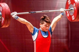 Lực sỹ Trịnh Văn Vinh giãn dây chằng vẫn giành huy chương bạc cử tạ