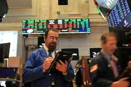 Giao dịch viên tại Sàn giao dịch chứng khoán New York, Mỹ. (Nguồn: THX/TTXVN)