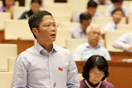 Bộ trưởng Bộ Công Thương Trần Tuấn Anh giải trình làm rõ vấn đề đại biểu Quốc hội nêu. (Ảnh: Phương Hoa/TTXVN)