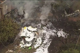 Xác máy bay gặp nạn tại thành phố Vinhedo, bang Sao Paulo, Brazil. (Ảnh: TV Globo/TTXVN)