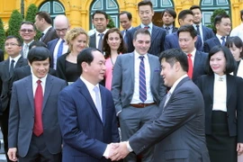 Chủ tịch nước Trần Đại Quang với các đại biểu doanh nghiệp Brunei. (Ảnh: Nhan Sáng/TTXVN)