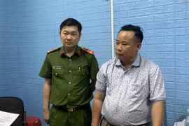 Đối tượng Nguyễn Văn Minh tại cơ quan điều tra. (Ảnh: TTXVN phát)