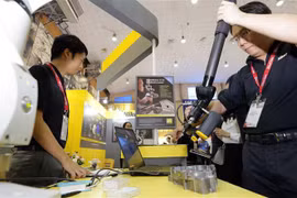 Gian triển lãm công nghệ in laser đến từ Nhật Bản. (Ảnh: Trần Việt/TTXVN)