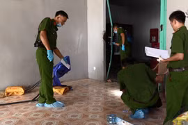 Các đơn vị nghiệp vụ thu thập chứng cứ, điều tra vụ án. (Ảnh: Nguyễn Văn Việt/TTXVN)