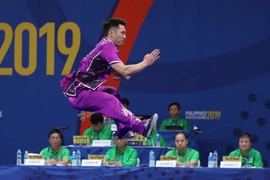 Trần Xuân Hiệp thi đấu nội dung trường quyền nam. (Ảnh: Hoàng Linh/TTXVN)