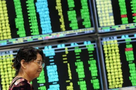 Bảng tỷ giá chứng khoán tại sàn giao dịch ở Cửu Giang, tỉnh Giang Tây, Trung Quốc. (Ảnh minh họa. THX/TTXVN)