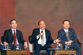 Thủ tướng Nguyễn Xuân Phúc đối thoại tại Diễn đàn kinh tế Việt Nam năm 2018. (Ảnh: Thống Nhất/TTXVN)