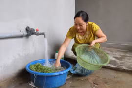 Người dân sử dụng nguồn nước sạch phục vụ sinh hoạt hàng ngày. (Ảnh minh họa. Việt Dũng/TTXVN)