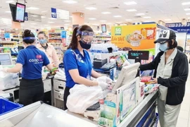 Các điểm bán thuộc Saigon Co.op đảm bảo quy định phòng, chống dịch bệnh COVID-19. (Ảnh: TTXVN phát)