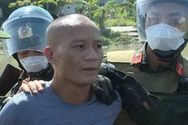 Đối tượng Trương Duy Giáp bị bắt khi đang thực hiện hành vi mua bán trái phép chất ma túy. (Ảnh: TTXVN phát)