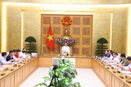 Phó Thủ tướng Vũ Đức Đam chủ trì cuộc họp. (Ảnh: Văn Điệp/TTXVN)