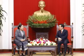 Ông Võ Văn Thưởng tiếp bà Sisay Leudetmounsone. (Ảnh: An Đăng/TTXVN)