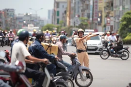 Cảnh sát giao thông Hà Nội nỗ lực đảm bảo an toàn cho Kỳ thi Trung học Phổ thông Quốc Gia (Ảnh minh họa. Nguồn: Vietnam+) 
