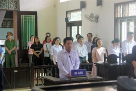 Bị cáo Nguyễn Văn Chánh (Chánh Văn phòng Cục Thi hành án Dân sự tỉnh Bình Định) tại phiên tòa sơ thẩm. (Ảnh: Nguyên Linh/TTXVN)