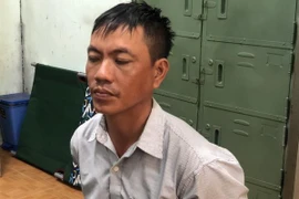 Đối tượng Trương Tấn Đạt tại cơ quan công an vào trưa 20/10. (Ảnh: Thế Anh/TTXVN) 