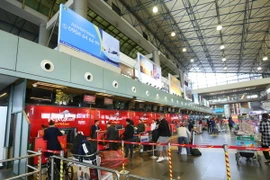 Quầy làm thủ tục của VietjetAir tại sảnh A nội địa, sân bay quốc tế Nội Bài, Hà Nội. (Ảnh: Huy Hùng/TTXVN)