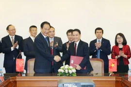 Lễ ký kết. (Ảnh: Doãn Tấn/TTXVN)
