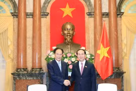 Chủ tịch nước Trần Đại Quang tiếp Xã trưởng Tân Hoa xã Thái Danh Chiếu nhân chuyến thăm và làm việc tại Việt Nam. (Ảnh: Nhan Sáng/TTXVN)