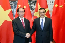 Chủ tịch nước Trần Đại Quang gặp Thủ tướng Trung Quốc Lý Khắc Cường. (Ảnh: Nhan Sáng/TTXVN)