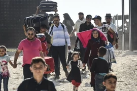 Hàng chục nghìn người tị nạn Syria tại Thổ Nhĩ Kỳ đang tạm thời trở về quê nhà để tham gia dịp lễ Eid al-Adha ngày 27/8 vừa qua. (Ảnh: AFP/TTXVN)